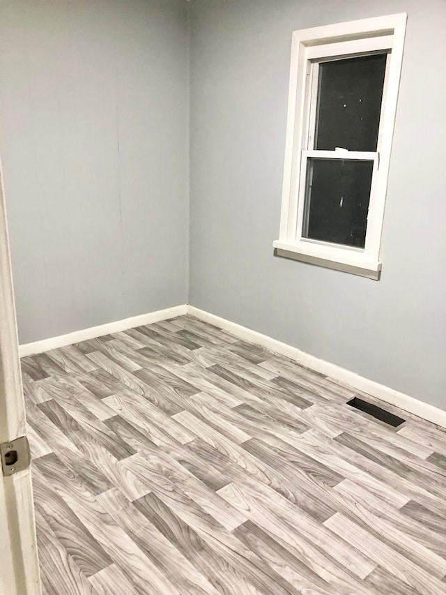 4127 Coggins Ave, Flint, MI 48506 - spare room with baseboards and wood finished floors