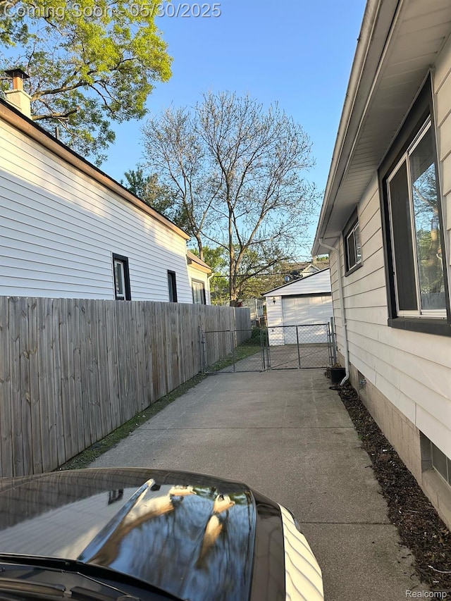 1228 E Jarvis Ave, Hazel Park, MI 48030 - view of patio with a gate and a garage