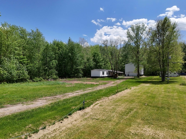 16747 Williamsville St, Vandalia, MI 49095 - view of green lawn with a wooded view