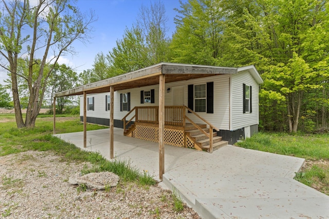 16747 Williamsville St, Vandalia, MI 49095 - manufactured / mobile home featuring a porch and a patio