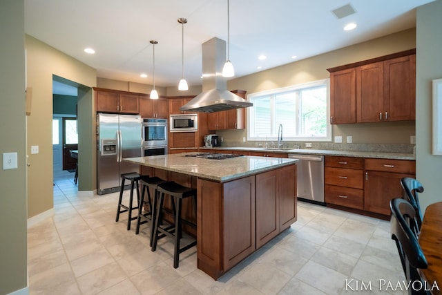 3099 Pickford Dr SE, Ada, MI 49301 - kitchen featuring appliances with stainless steel finishes, island range hood, a sink, light stone countertops, and a breakfast bar area