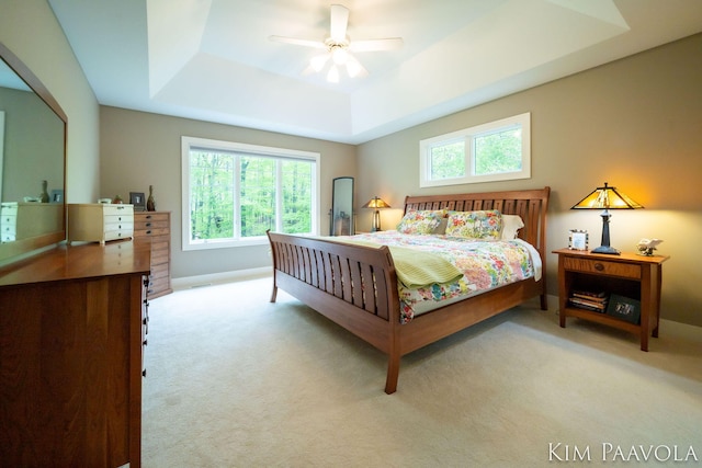 3099 Pickford Dr SE, Ada, MI 49301 - bedroom with a raised ceiling, carpet, and ceiling fan