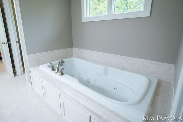3099 Pickford Dr SE, Ada, MI 49301 - full bathroom with a whirlpool tub and tile patterned floors