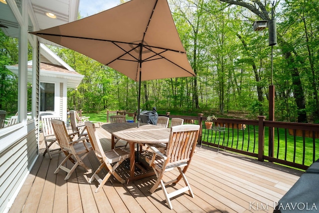 3099 Pickford Dr SE, Ada, MI 49301 - wooden terrace featuring outdoor dining area and a yard