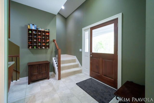 3099 Pickford Dr SE, Ada, MI 49301 - entrance foyer with stairway and baseboards