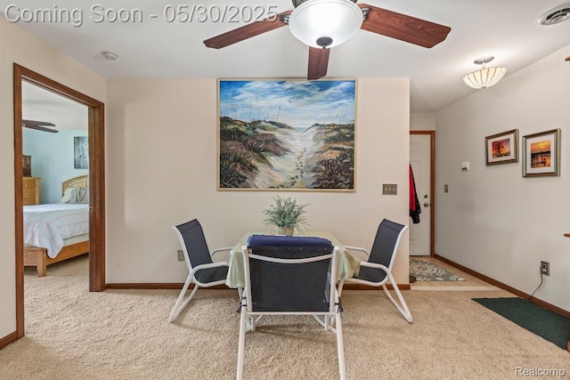 9200 River Rd Unit 3, Clay, MI 48001 - dining space featuring light colored carpet, a ceiling fan, and baseboards