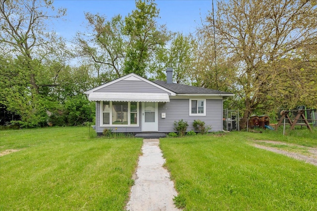 228 Hughes Ave, Pontiac, MI 48341 - bungalow-style home featuring a chimney