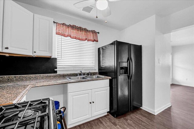 228 Hughes Ave, Pontiac, MI 48341 - kitchen with black fridge with ice dispenser, a sink, ceiling fan, dark wood-style floors, and white cabinetry
