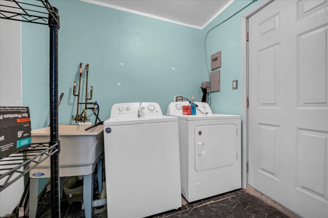 228 Hughes Ave, Pontiac, MI 48341 - laundry room with dark marble finish flooring and washer and dryer