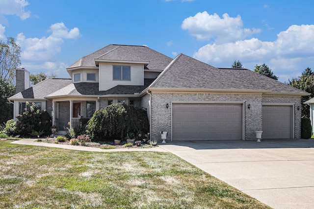 2512 Misty Ln, Davison, MI 48423 - view of front of property featuring an attached garage, concrete driveway, a front lawn, brick siding, and a shingled roof