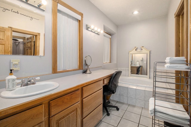 2512 Misty Ln, Davison, MI 48423 - bathroom with tile patterned flooring, vanity, and a relaxing tiled tub