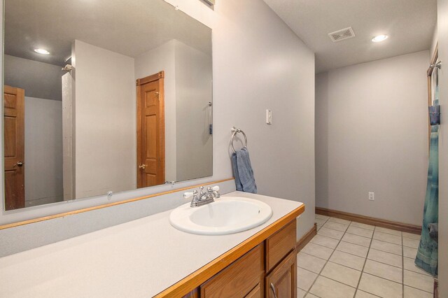 2512 Misty Ln, Davison, MI 48423 - bathroom with vanity, tile patterned flooring, baseboards, and recessed lighting
