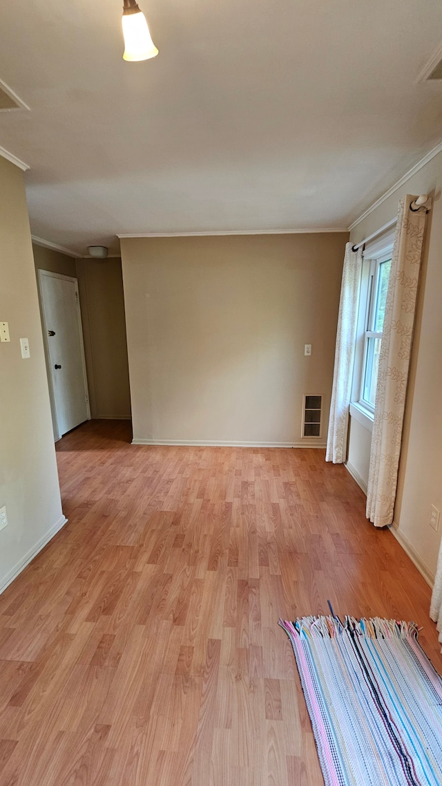 938 Little Hill Ct, Rochester Hills, MI 48307 - empty room featuring ornamental molding, light wood-style floors, and baseboards