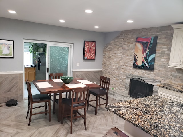 15701 Middlebelt Rd, Romulus, MI 48174 - dining area featuring a stone fireplace and recessed lighting
