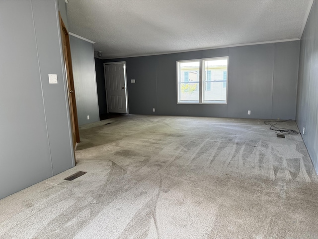 829 Savannah River Dr Unit 82, Adrian, MI 49221 - unfurnished room with ornamental molding, carpet flooring, and a textured ceiling