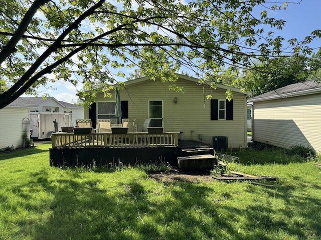 829 Savannah River Dr Unit 82, Adrian, MI 49221 - back of property with a yard, a wooden deck, and cooling unit
