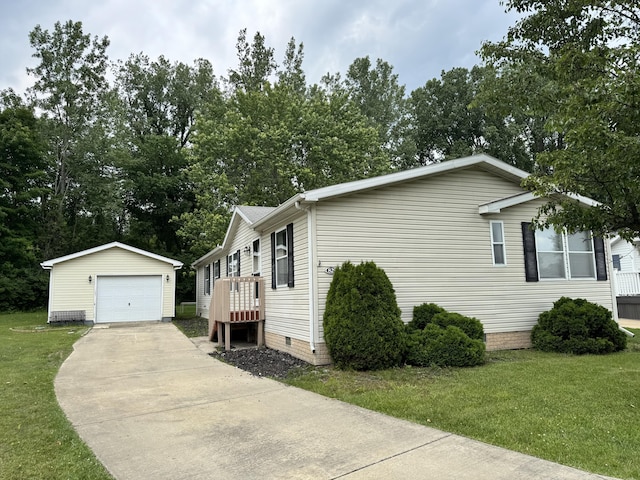 829 Savannah River Dr, Adrian, MI 49221 - view of home's exterior with an outdoor structure, a garage, crawl space, a lawn, and concrete driveway