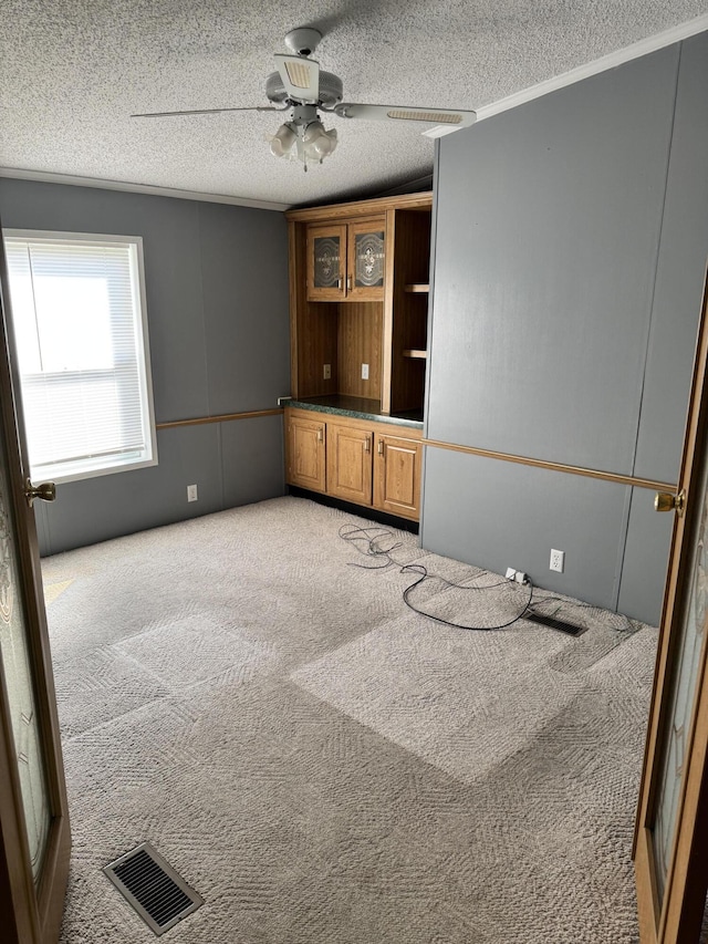 829 Savannah River Dr, Adrian, MI 49221 - unfurnished room featuring light colored carpet, ceiling fan, and a textured ceiling