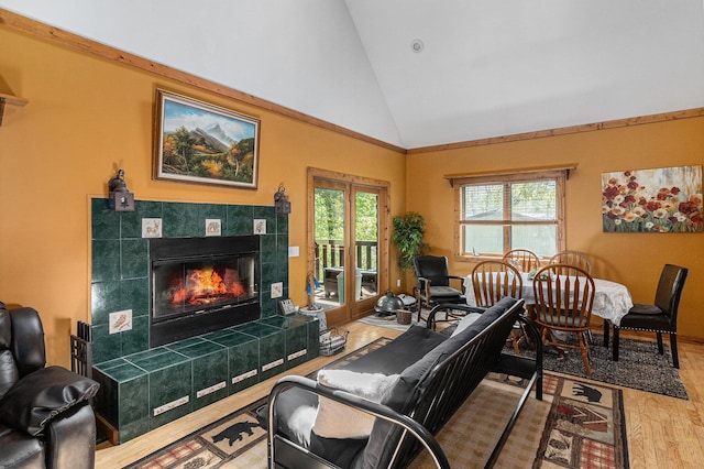 18862 Oxbow Dr, Barryton, MI 49305 - living area with wood finished floors, a tile fireplace, and high vaulted ceiling