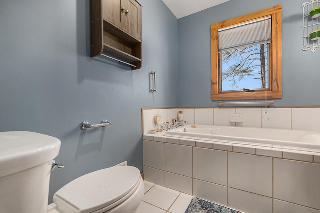18862 Oxbow Dr, Barryton, MI 49305 - bathroom featuring toilet, a garden tub, and tile patterned flooring