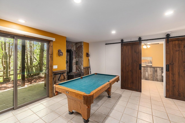 18862 Oxbow Dr, Barryton, MI 49305 - rec room featuring a barn door, pool table, a wainscoted wall, light tile patterned floors, and recessed lighting