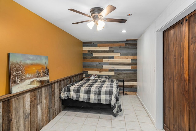18862 Oxbow Dr, Barryton, MI 49305 - bedroom featuring wood walls, light tile patterned floors, recessed lighting, and ceiling fan