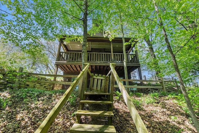 18862 Oxbow Dr, Barryton, MI 49305 - rear view of property featuring stairs, a wooden deck, and fence
