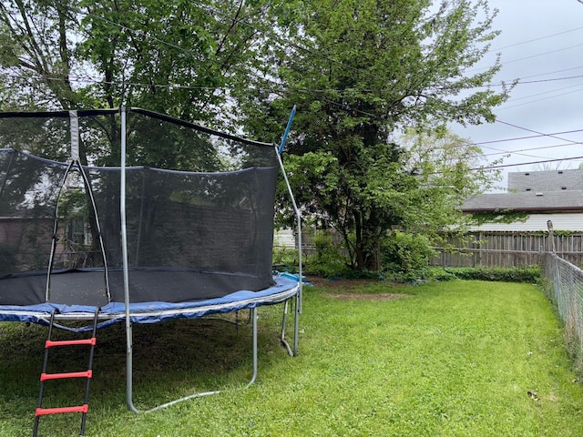 view of yard featuring a trampoline