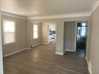 2422 Missouri Ave, Flint, MI 48506 - unfurnished room with plenty of natural light, dark wood finished floors, and baseboards
