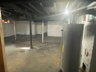 2422 Missouri Ave, Flint, MI 48506 - unfinished below grade area with water heater