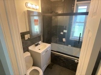 2422 Missouri Ave, Flint, MI 48506 - full bath featuring toilet, a shower with shower door, and vanity