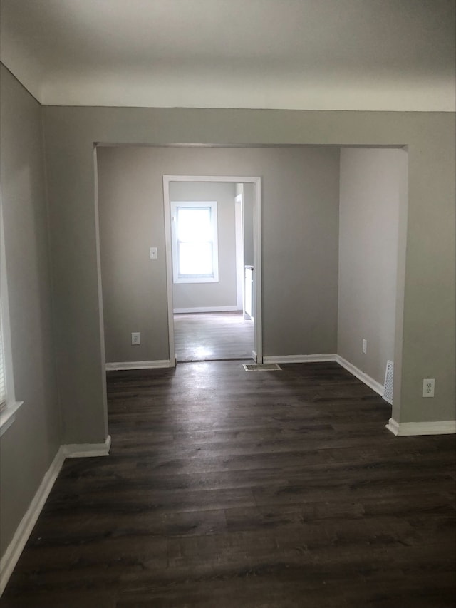 2422 Missouri Ave, Flint, MI 48506 - empty room with dark wood finished floors and baseboards