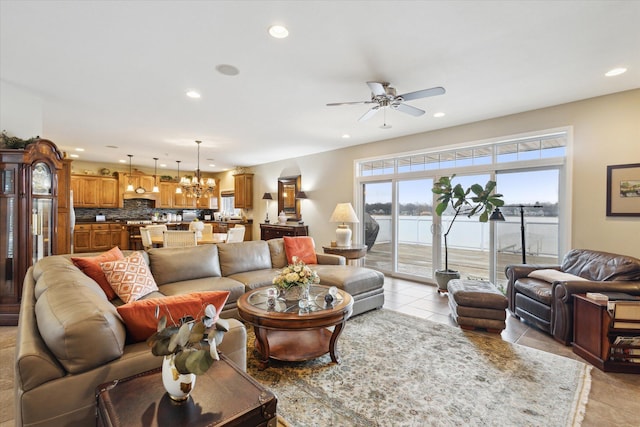 1259 Rose Dr, Niles, MI 49120 - living room with recessed lighting, ceiling fan, light tile patterned flooring, a chandelier, and a water view