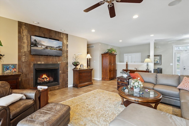 1259 Rose Dr, Niles, MI 49120 - living area with a ceiling fan, recessed lighting, a tiled fireplace, light tile patterned floors, and baseboards