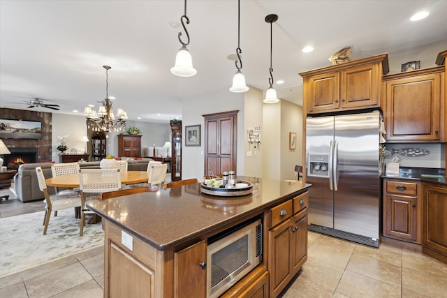 1259 Rose Dr, Niles, MI 49120 - kitchen with stainless steel appliances, a fireplace, ceiling fan, open floor plan, and recessed lighting
