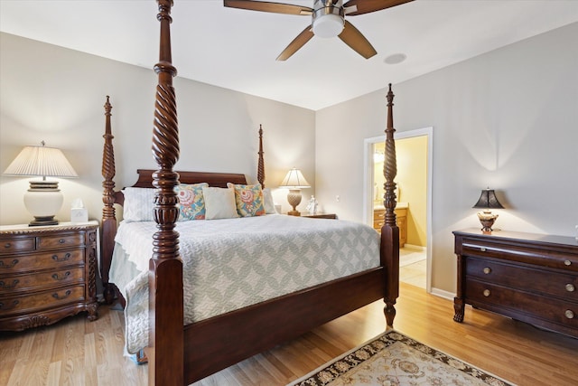 1259 Rose Dr, Niles, MI 49120 - bedroom featuring wood finished floors, a ceiling fan, and connected bathroom