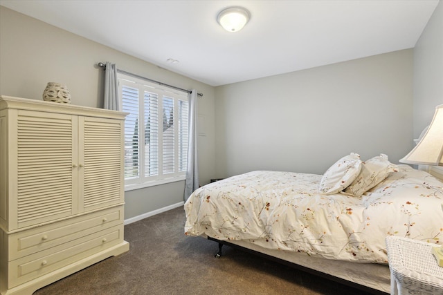 1259 Rose Dr, Niles, MI 49120 - bedroom featuring dark carpet and baseboards