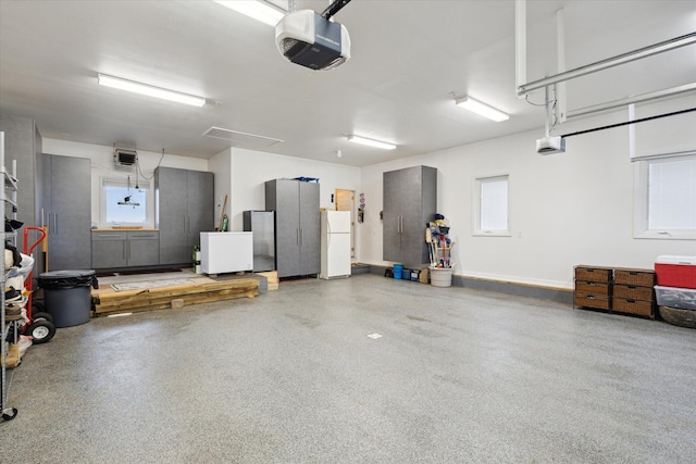 1259 Rose Dr, Niles, MI 49120 - garage featuring a garage door opener and freestanding refrigerator