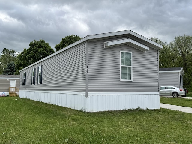 839 Oxford, Manitou Beach, MI 49253 - view of side of home featuring a yard