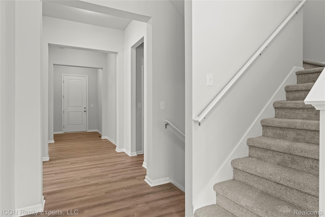 2396 Pondview Ln, Troy, MI 48085 - staircase with wood finished floors and baseboards