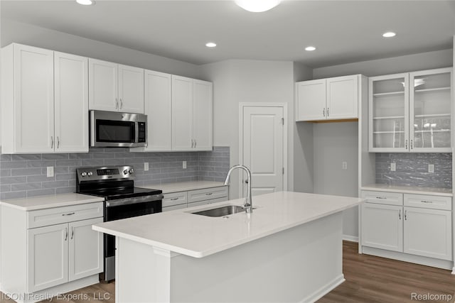 2396 Pondview Ln, Troy, MI 48085 - kitchen featuring stainless steel appliances, white cabinetry, dark wood finished floors, backsplash, and light countertops