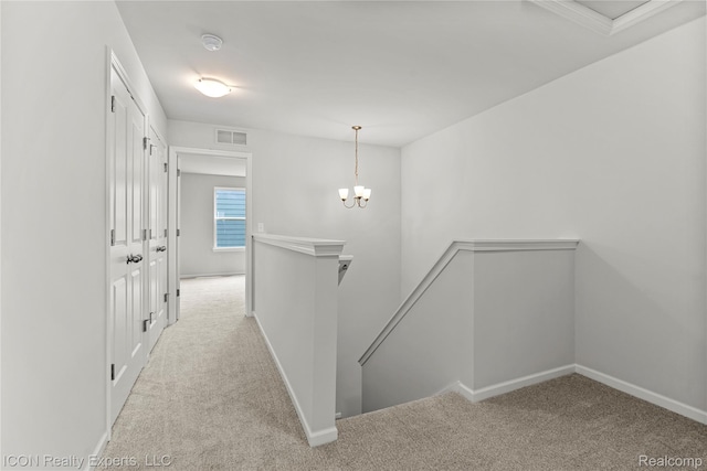 2396 Pondview Ln, Troy, MI 48085 - hallway featuring an upstairs landing, carpet floors, and a chandelier