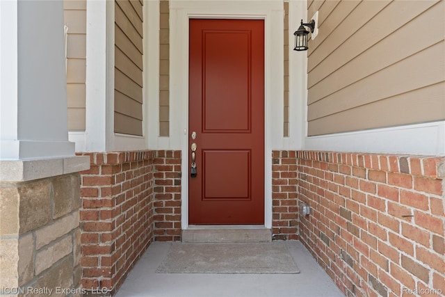 2396 Pondview Ln, Troy, MI 48085 - doorway to property featuring brick siding