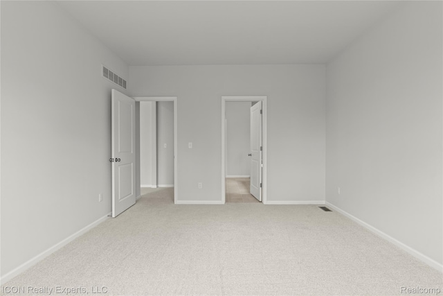 2396 Pondview Ln, Troy, MI 48085 - unfurnished bedroom with light carpet and a walk in closet