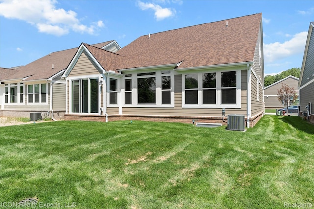 2396 Pondview Ln, Troy, MI 48085 - rear view of property with a lawn and roof with shingles