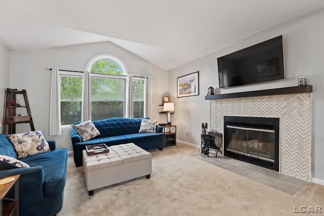 9705 Crescent Ct, Tecumseh, MI 49286 - carpeted living room featuring lofted ceiling, a tile fireplace, and baseboards