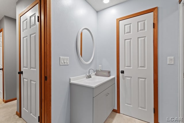 9705 Crescent Ct, Tecumseh, MI 49286 - bathroom featuring vanity and baseboards
