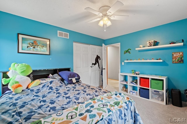9705 Crescent Ct, Tecumseh, MI 49286 - bedroom featuring carpet, a closet, and a ceiling fan