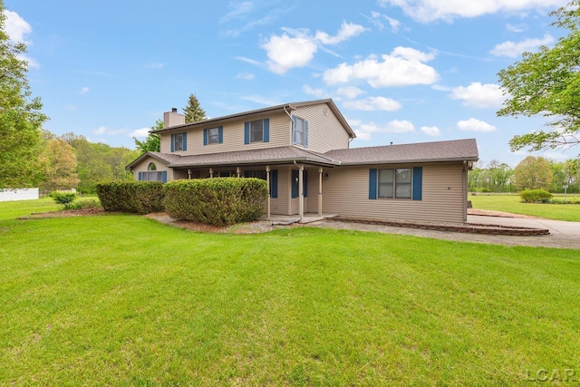 9705 Crescent Ct, Tecumseh, MI 49286 - rear view of house with a chimney, a lawn, and covered porch