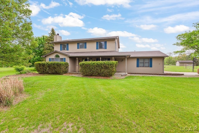 9705 Crescent Ct, Tecumseh, MI 49286 - view of front of home featuring a chimney, a front lawn, and covered porch
